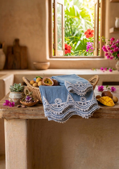 Heritage Stitch and Soleil Stitch Dish Towels styled together with tropical fruits and florals